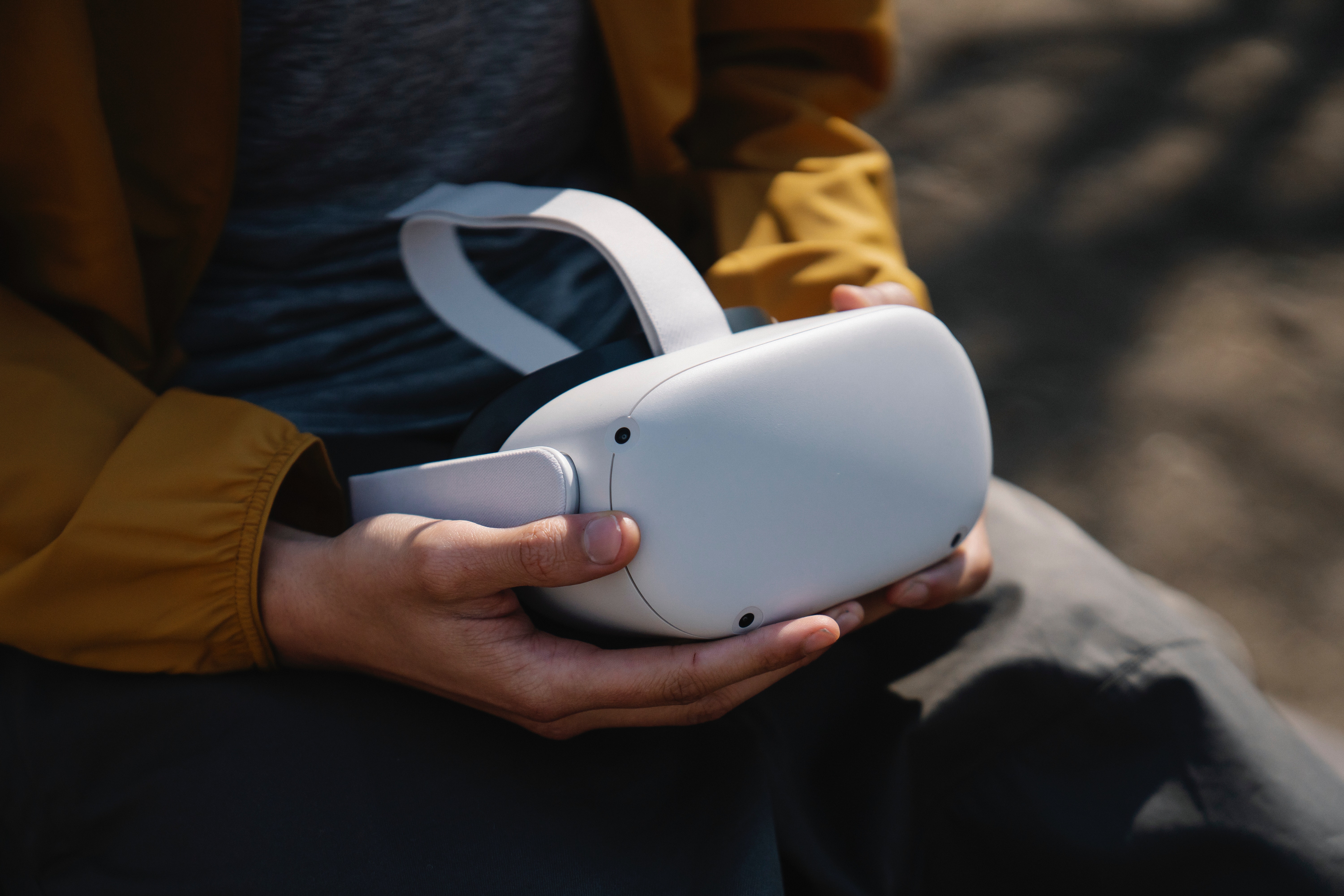 a person holding oculus quest virtual reality headset