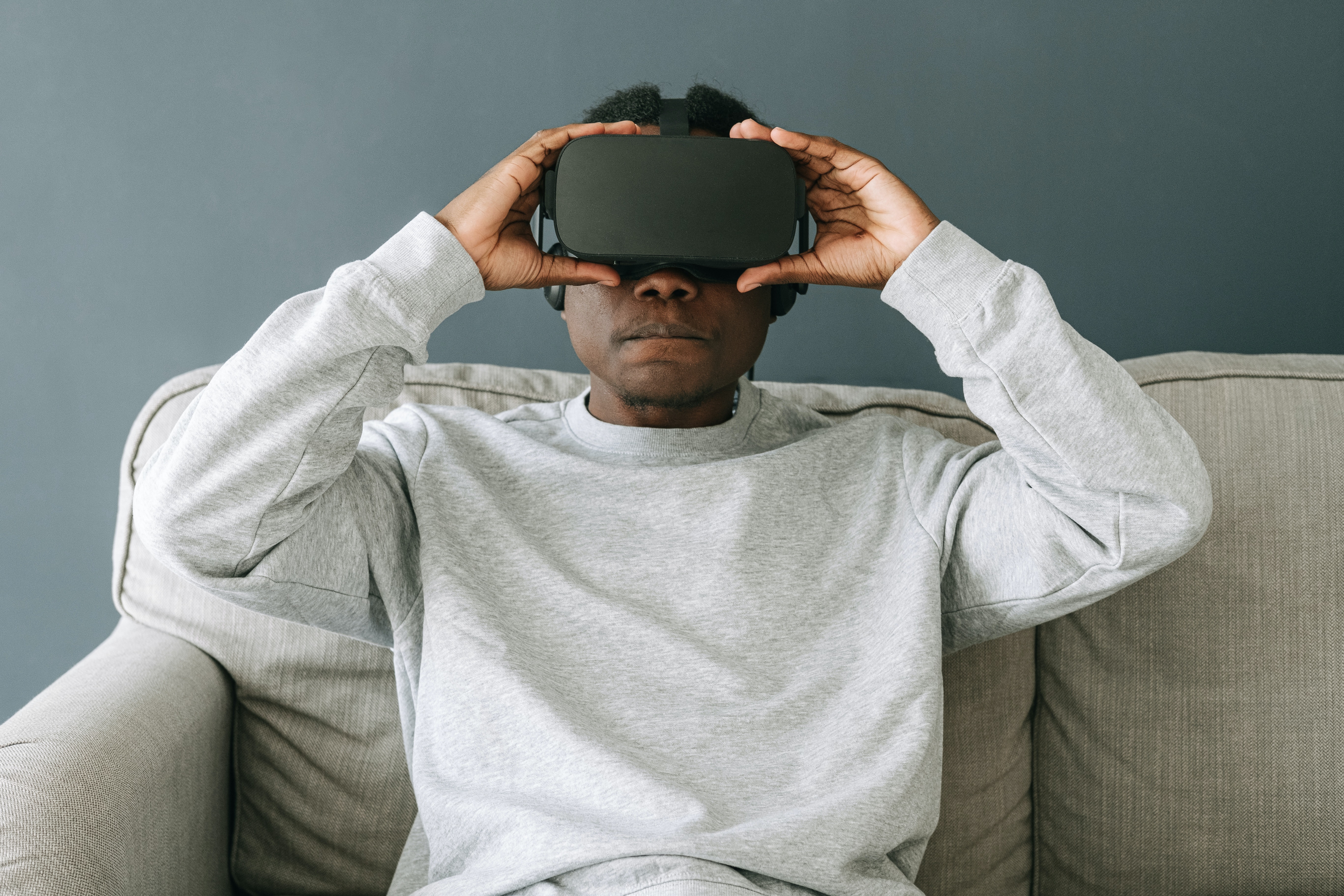 a person sitting and enjoying virtual reality experience